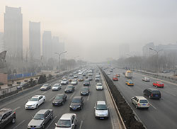 Cars on a foggy road - emissions